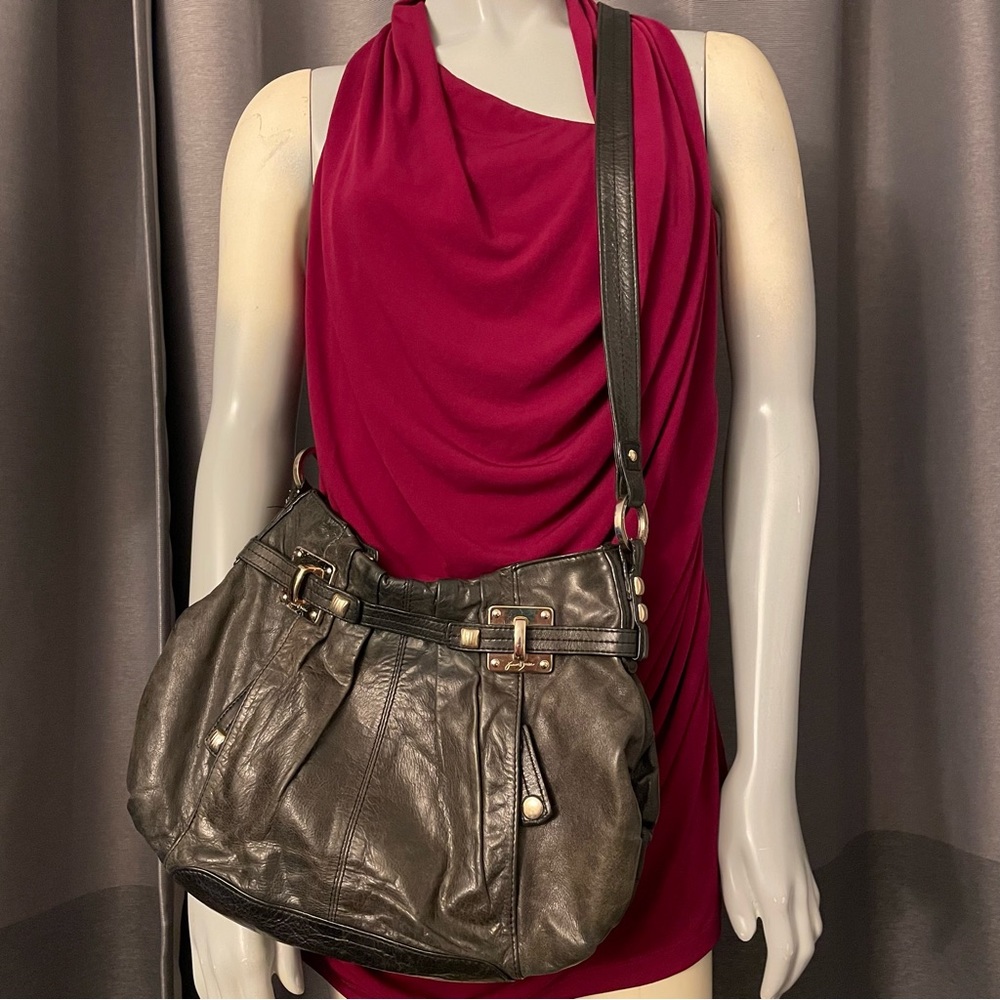 Be different with Junior Drake!  Gorgeous black leather crossbody bag in GUC.
